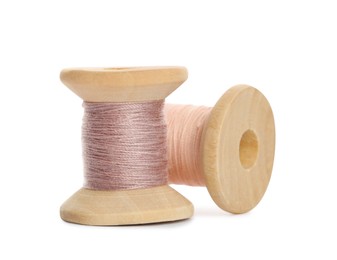 Different colorful sewing threads on white background