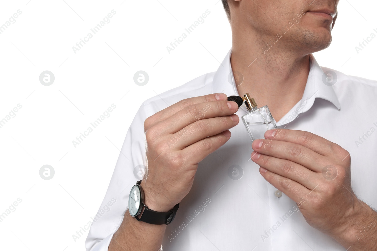 Photo of Handsome man applying perfume on neck against white background, closeup