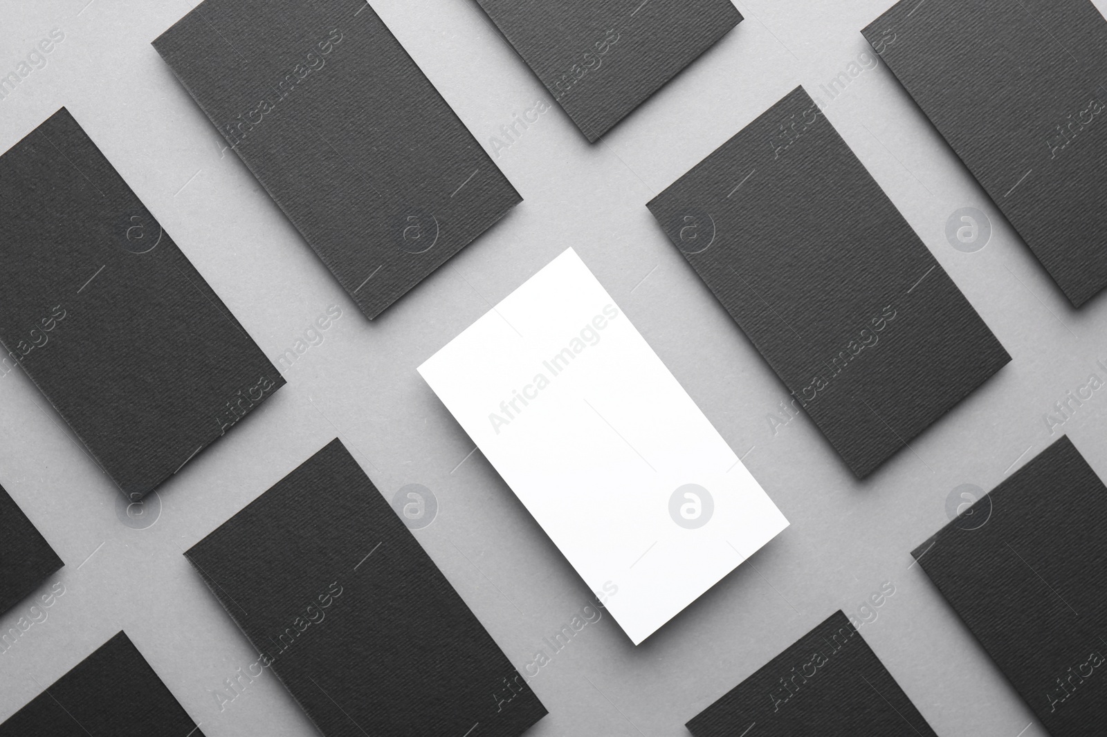 Photo of Blank business cards on light grey background, flat lay. Mockup for design