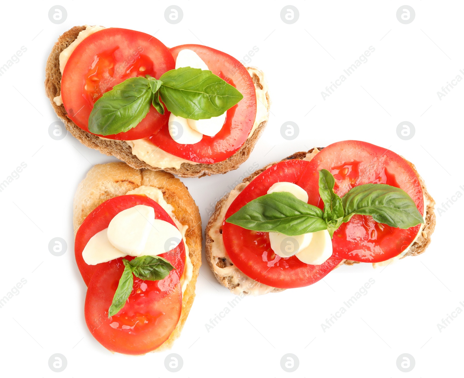 Photo of Tasty fresh tomato bruschettas on white background, top view