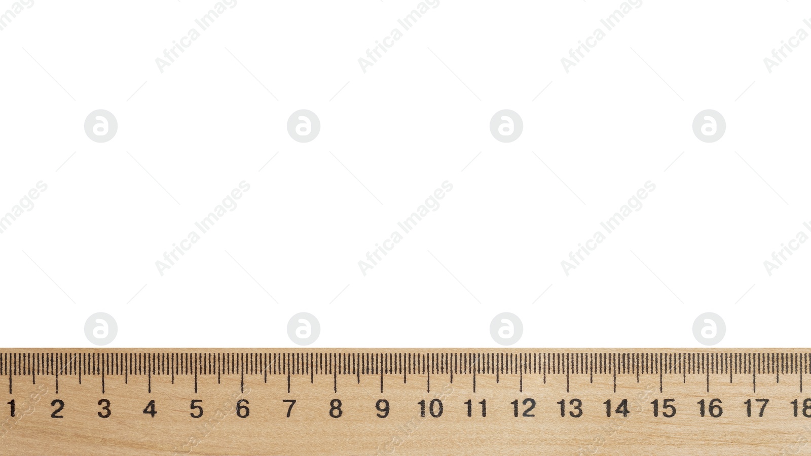 Photo of Wooden ruler with measuring length markings in centimeters isolated on white, top view