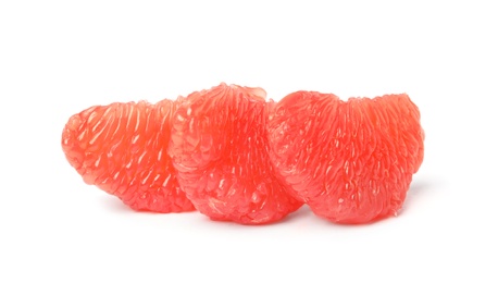 Slices of ripe juicy grapefruit on white background