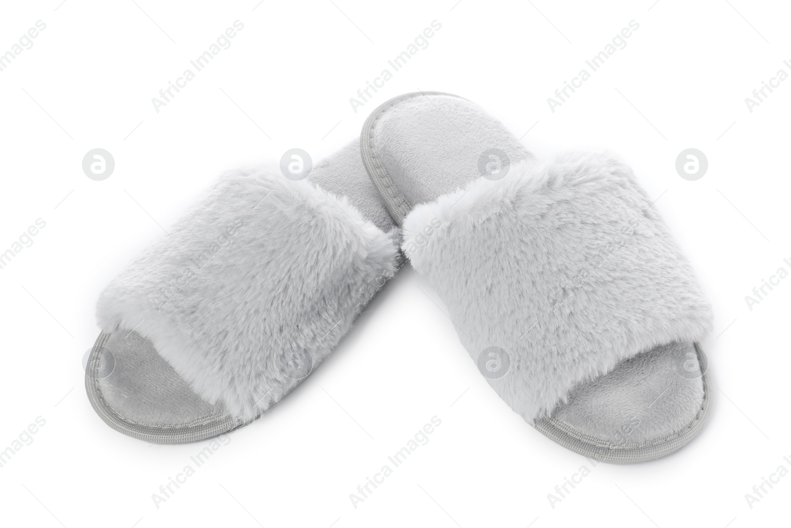 Photo of Pair of soft slippers with fur isolated on white