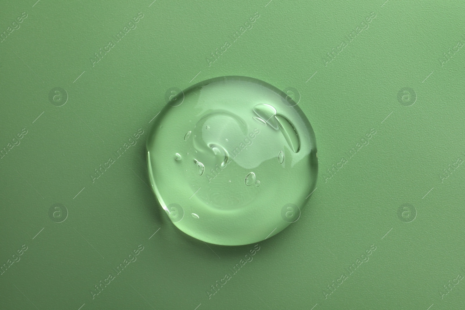 Photo of Sample of gel on green background, top view