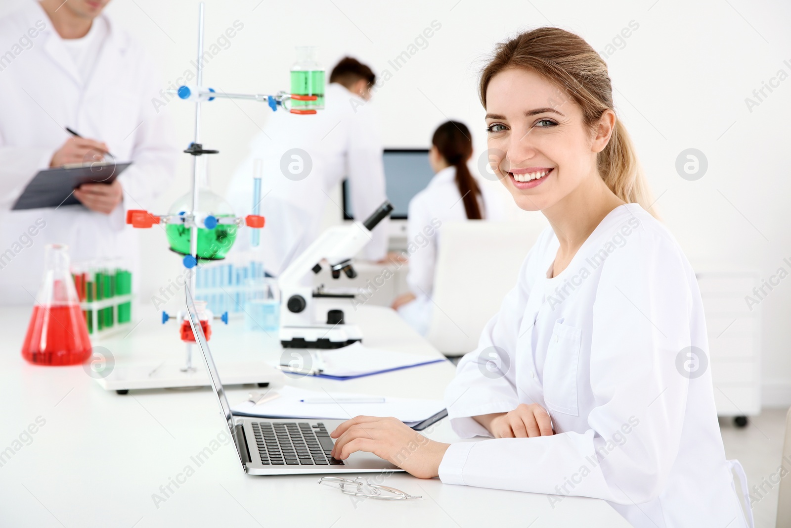 Photo of Medical student working with laptop in modern laboratory