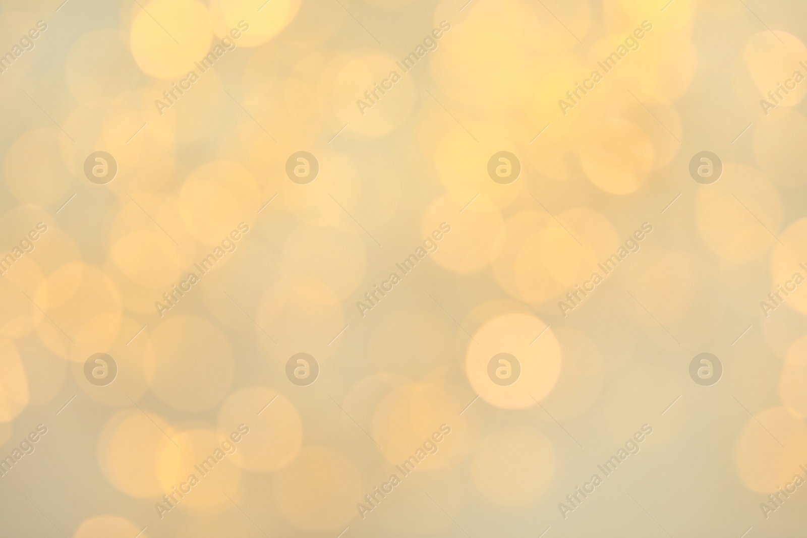 Photo of Gold glitter with bokeh effect on light background