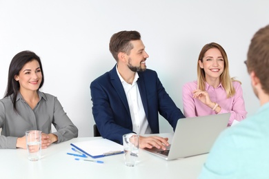 Human resources commission conducting job interview with applicant in office