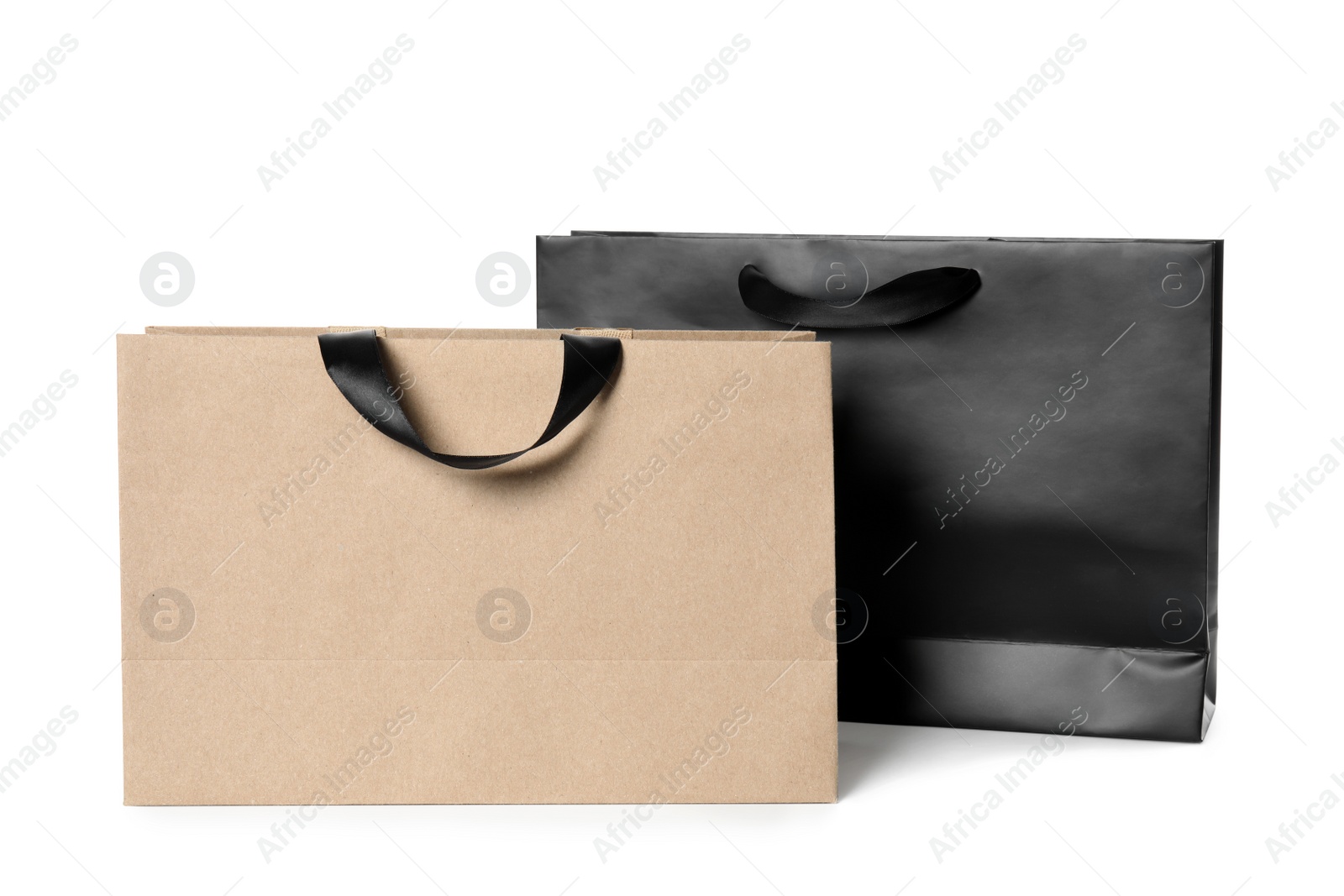 Photo of Paper shopping bags isolated on white. Mock up for design