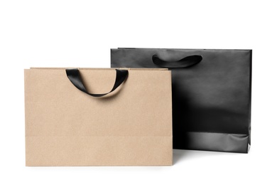 Photo of Paper shopping bags isolated on white. Mock up for design