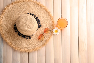 Flat lay composition with stylish hat on wooden background