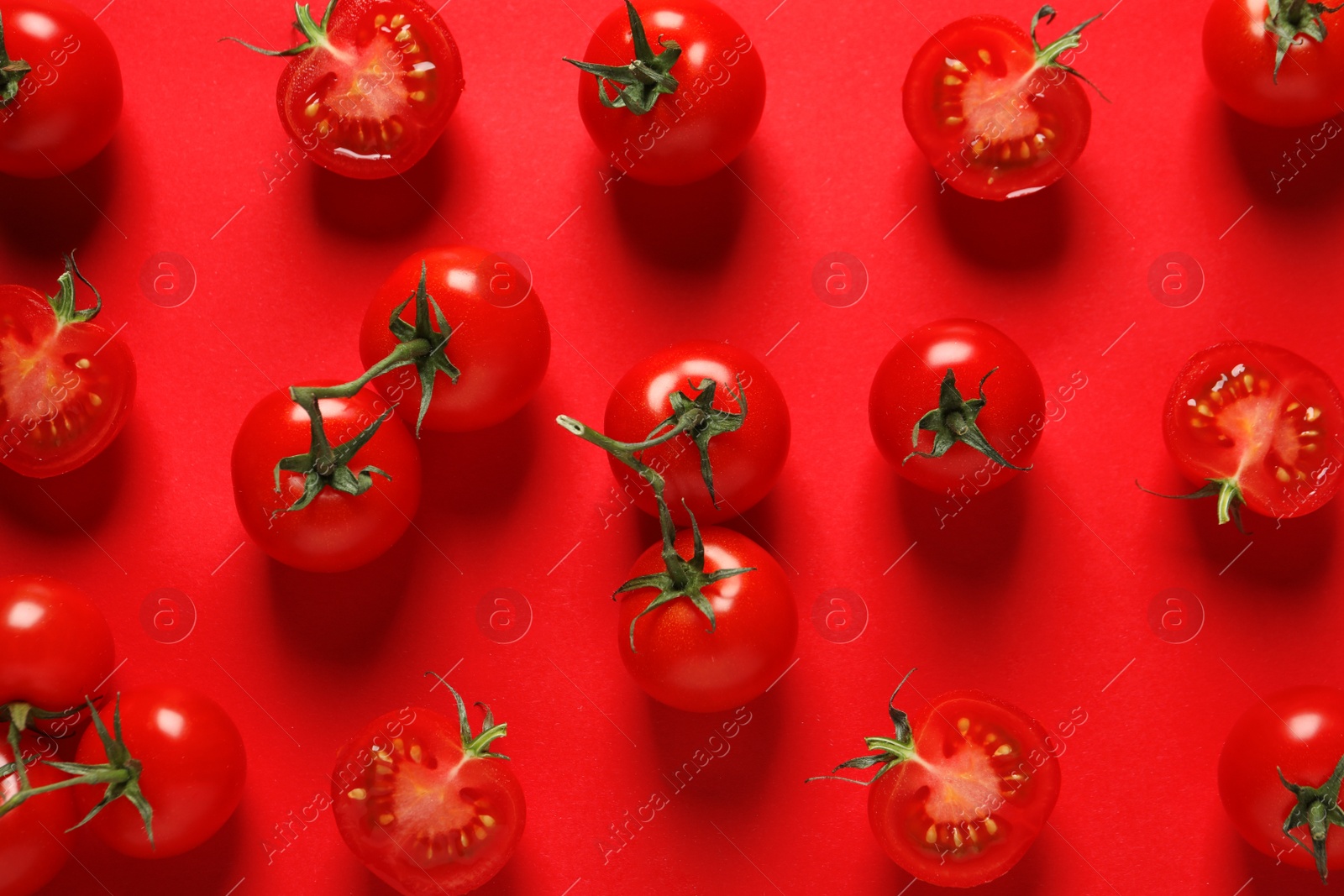 Photo of Flat lay composition with ripe cherry tomatoes on color background