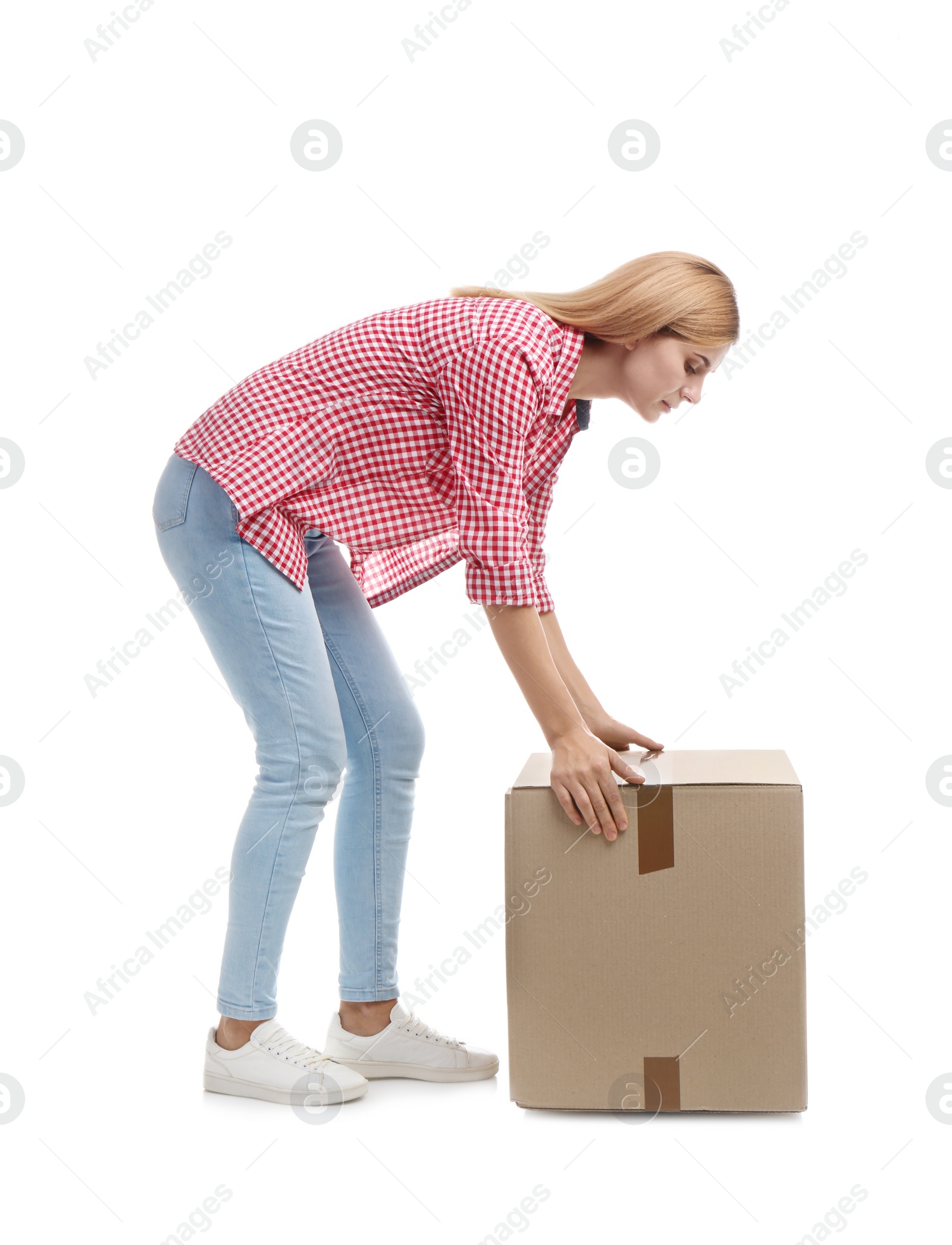 Photo of Full length portrait of woman lifting carton box on white background. Posture concept