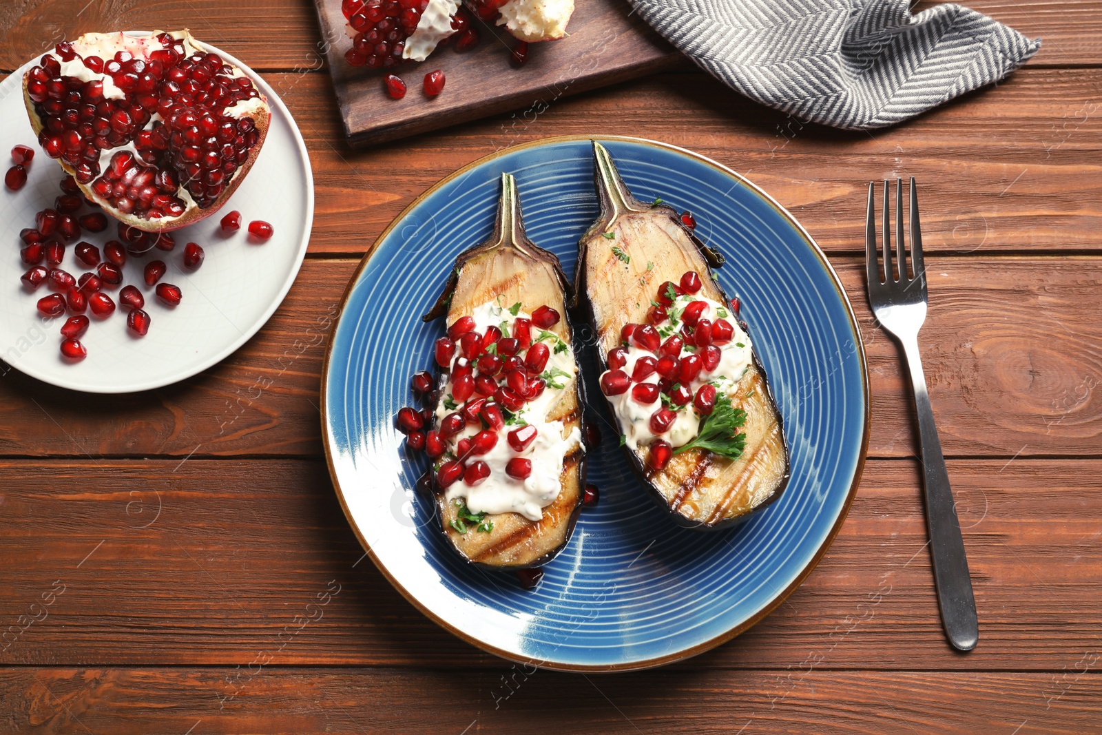 Photo of Flat lay composition with plate of fried eggplants on wooden table