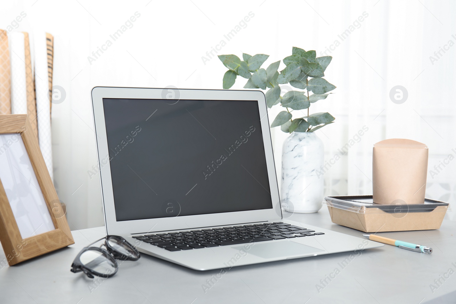 Photo of Cozy blogger workplace with laptop at home