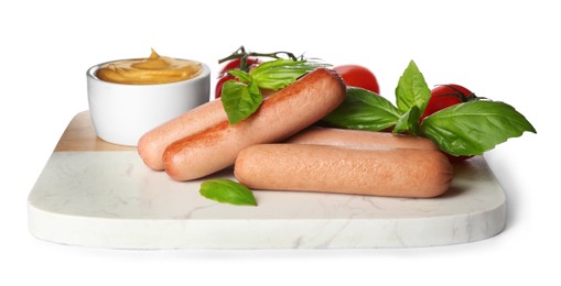Delicious vegetarian sausages with basil, tomatoes and sauce on white background