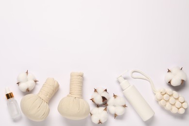 Photo of Bath accessories. Different personal care products and cotton flowers on white background, flat lay with space for text