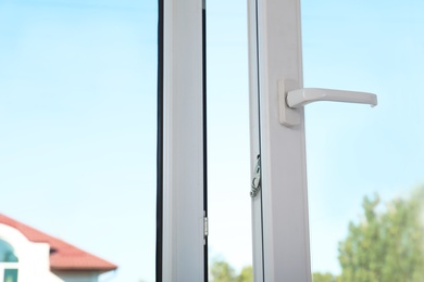 Photo of View of blue sky through modern window indoors