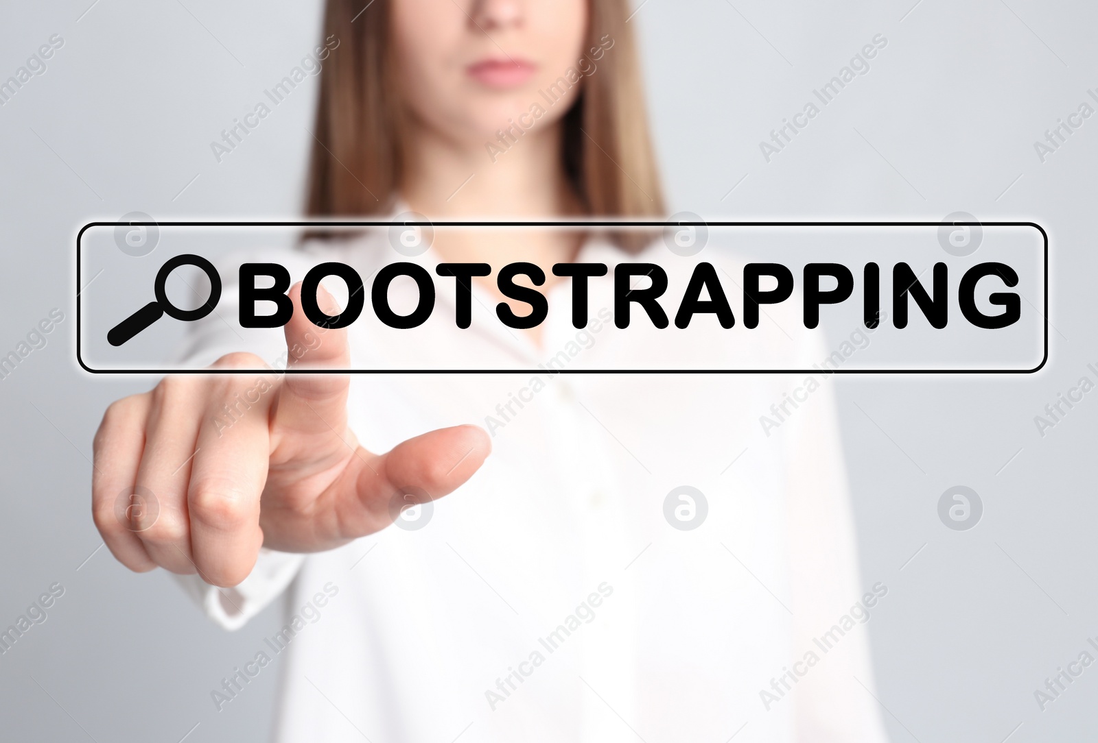 Image of Woman touching virtual screen with word BOOTSTRAPPING in search bar against light background, focus on hand