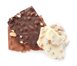 Different delicious chocolate with nuts on white background, top view