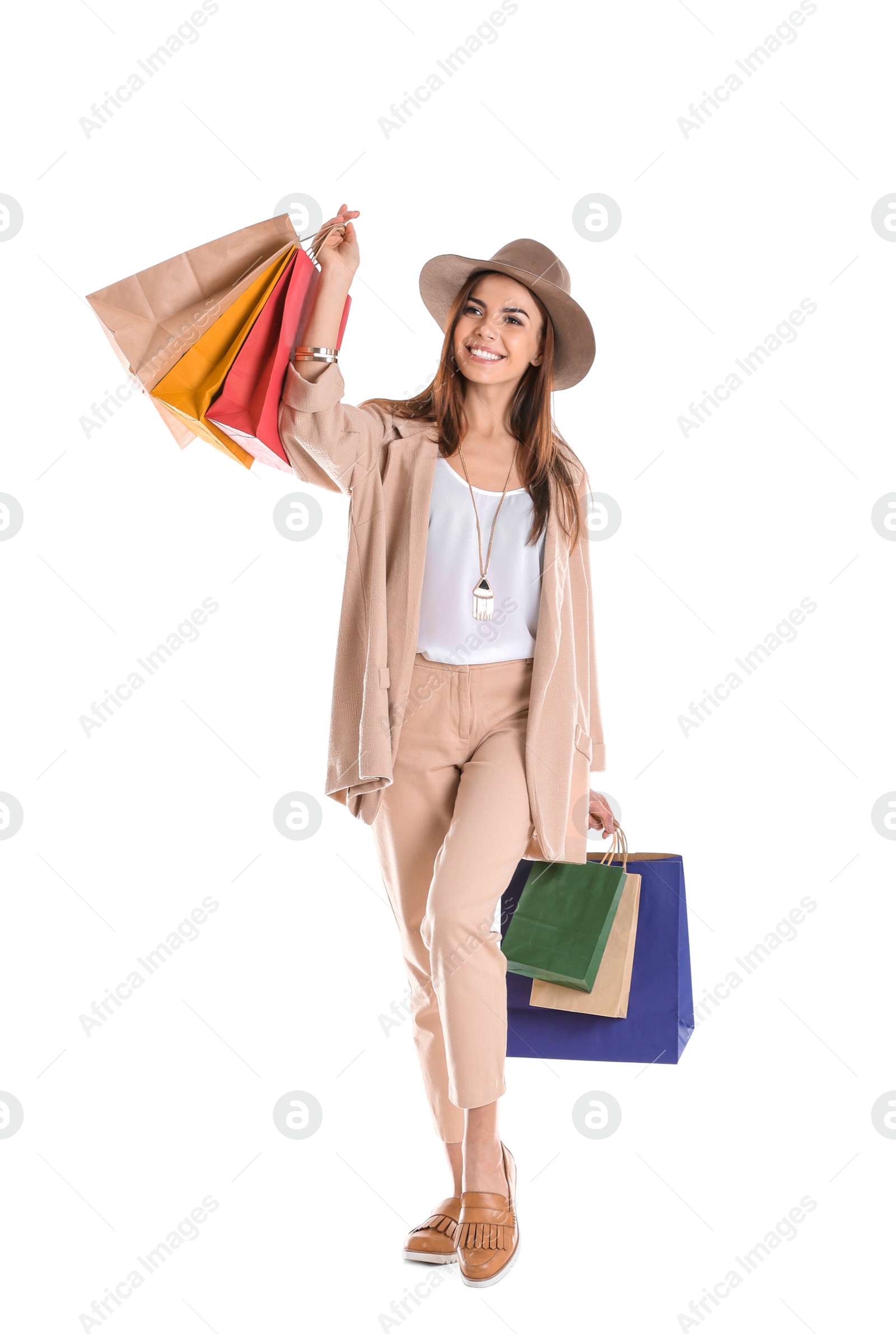 Photo of Young woman with shopping bags on white background