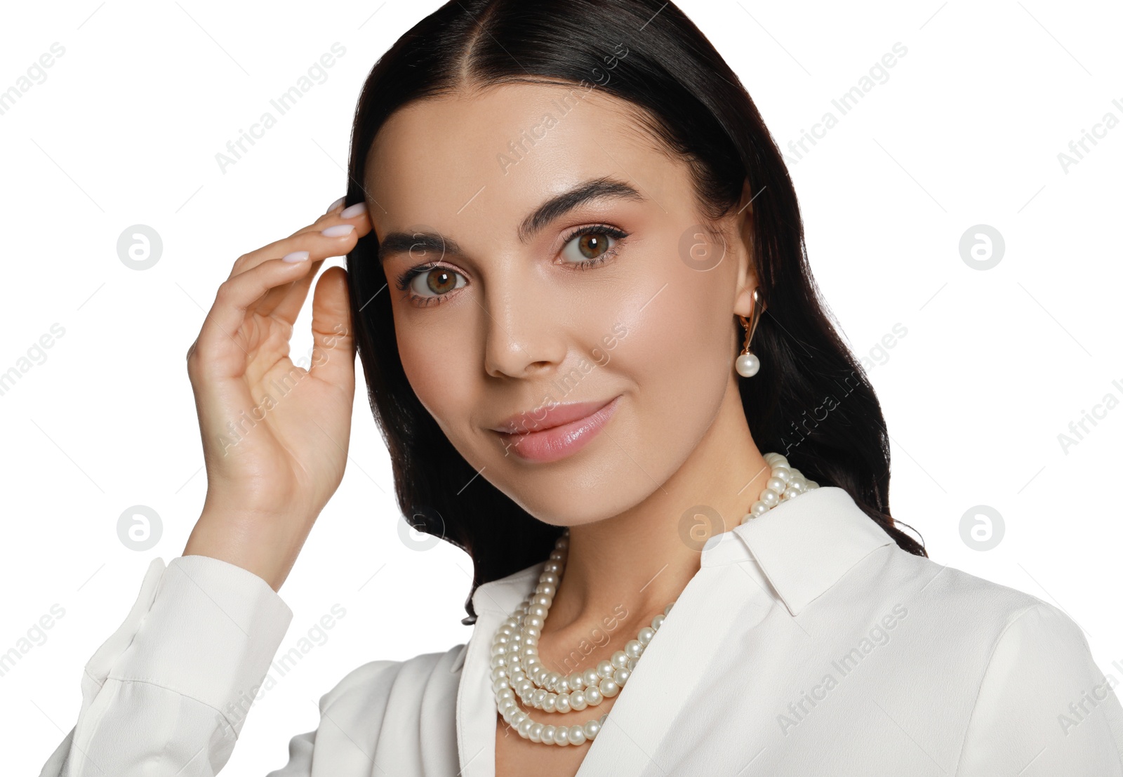 Photo of Young woman wearing elegant pearl jewelry on white background