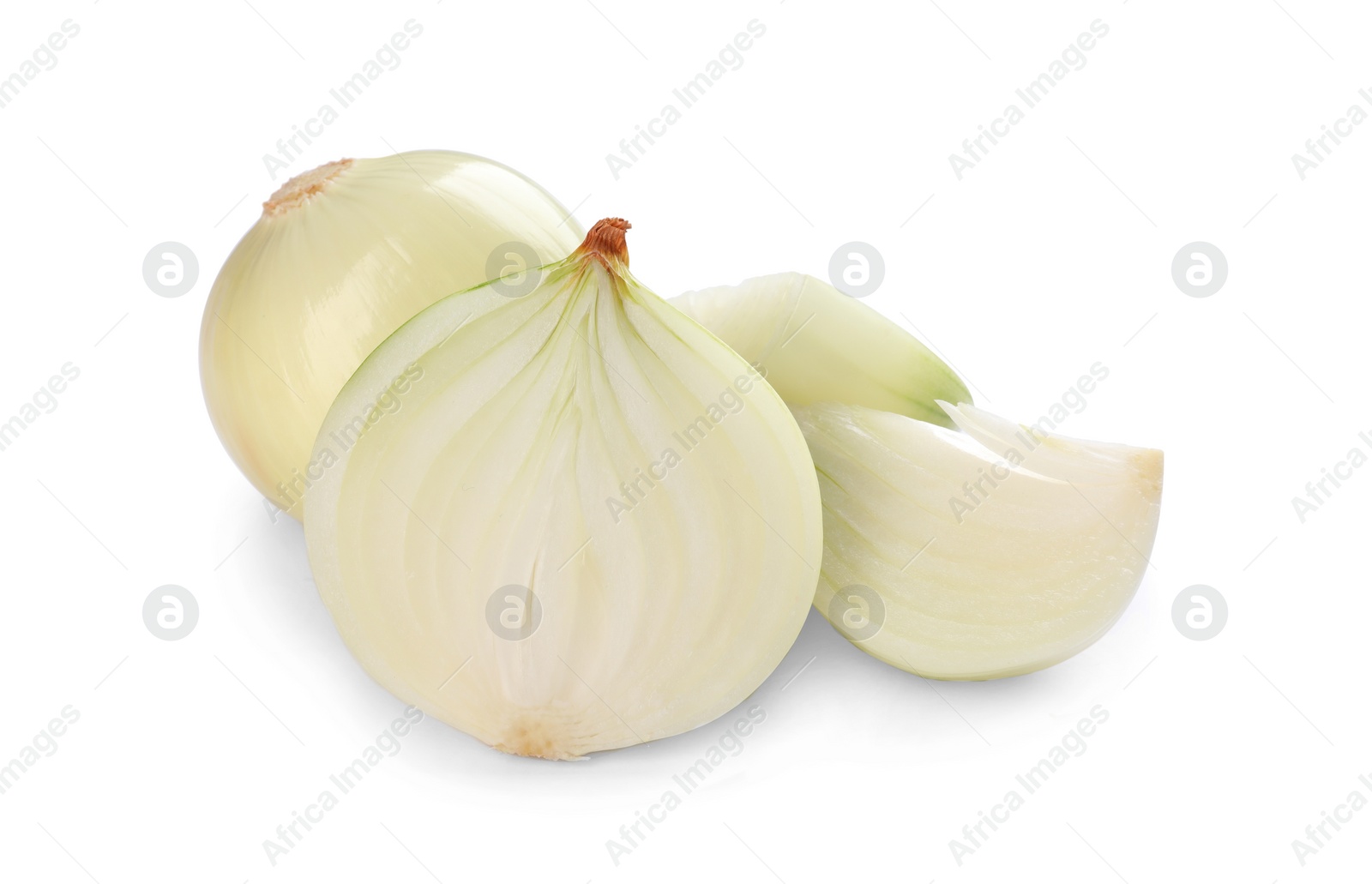 Photo of Whole and cut onions on white background