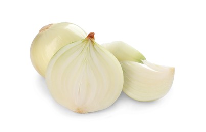 Photo of Whole and cut onions on white background