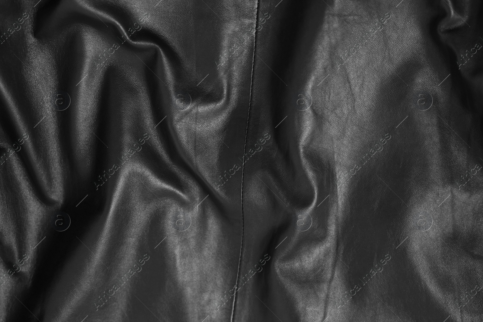 Photo of Texture of crumpled black leather as background, top view