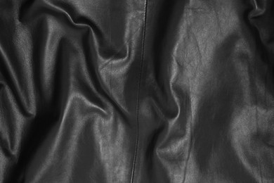 Photo of Texture of crumpled black leather as background, top view