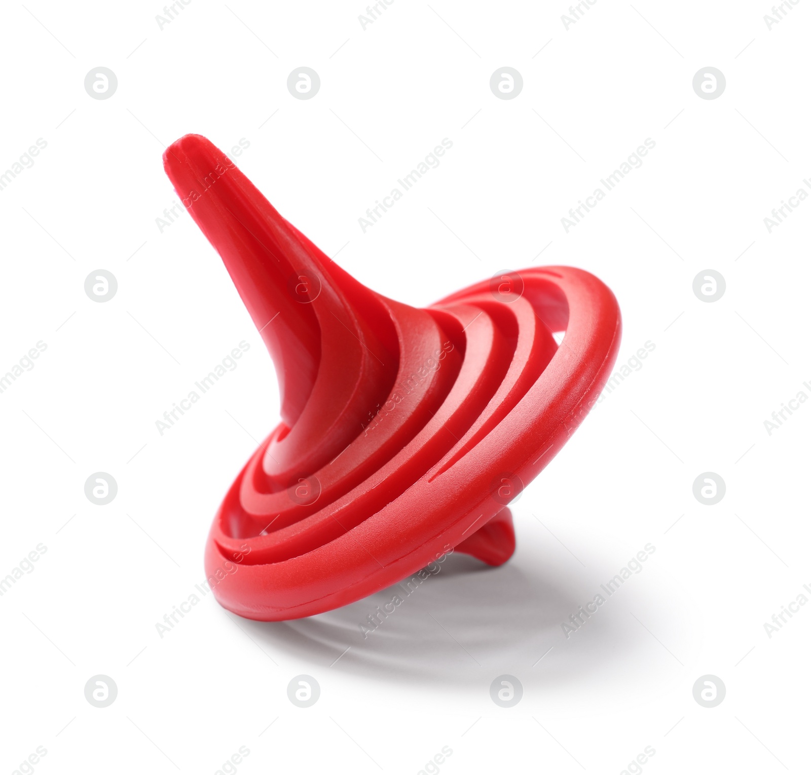 Photo of One red spinning top on white background