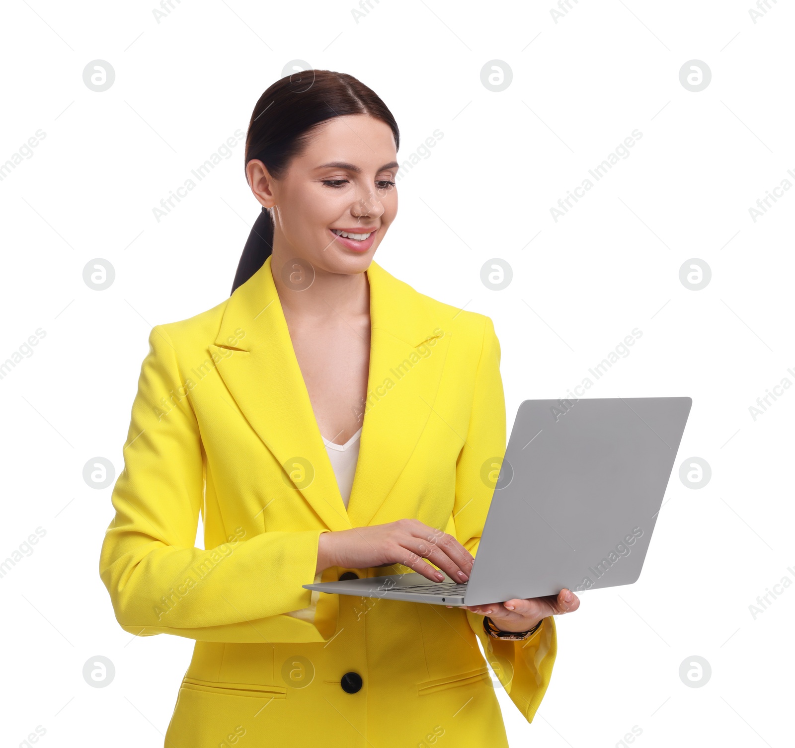 Photo of Beautiful businesswoman in yellow suit with laptop on white background