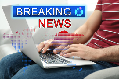 Image of Breaking News. Journalist working with laptop indoors, closeup. Digital world map