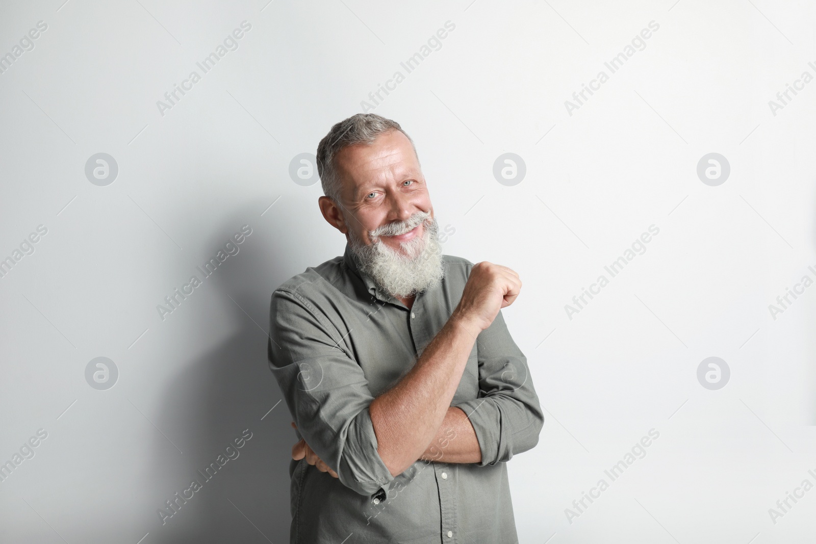 Photo of Portrait of handsome senior man on white background