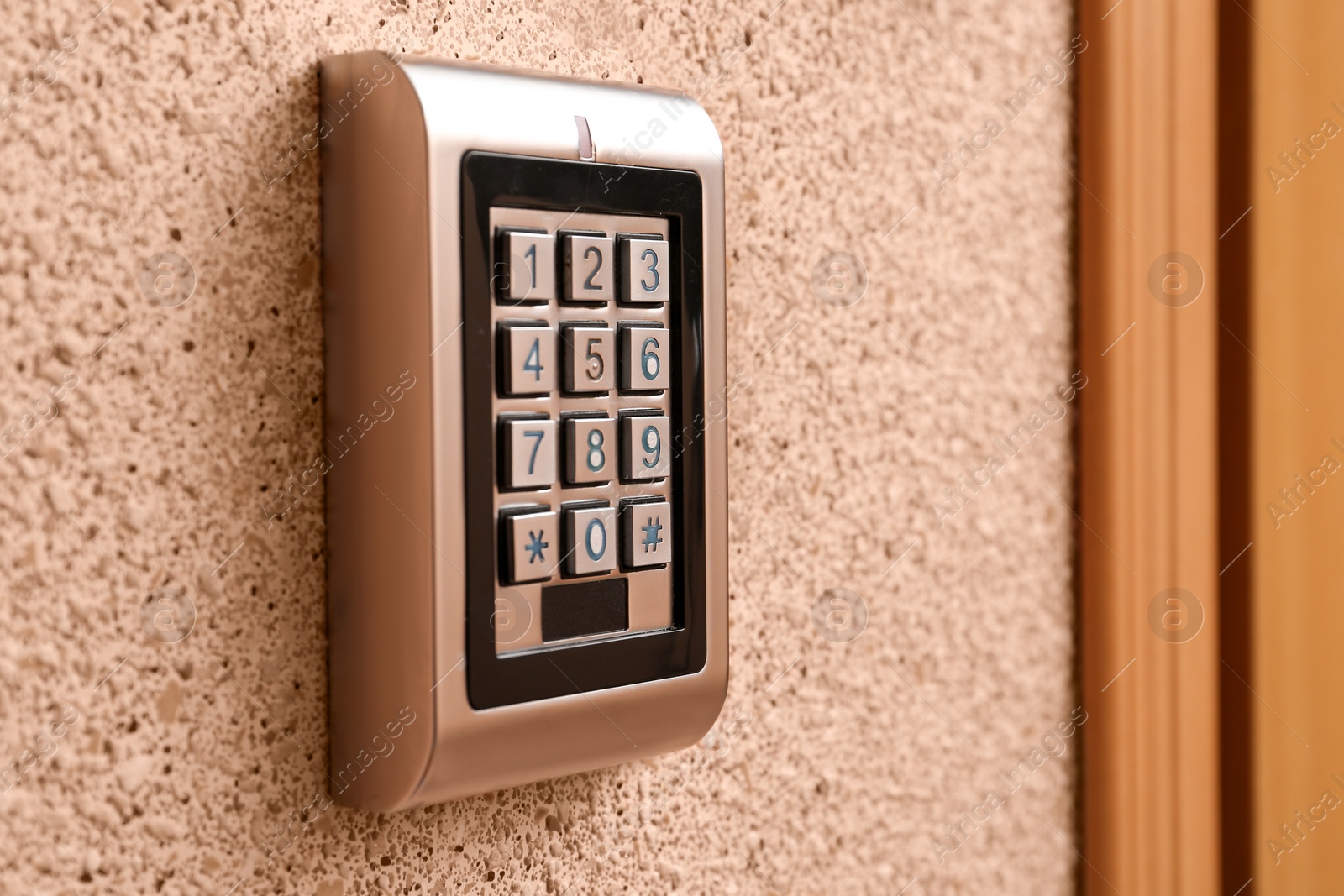 Photo of Keypad of modern electronic lock indoors, closeup