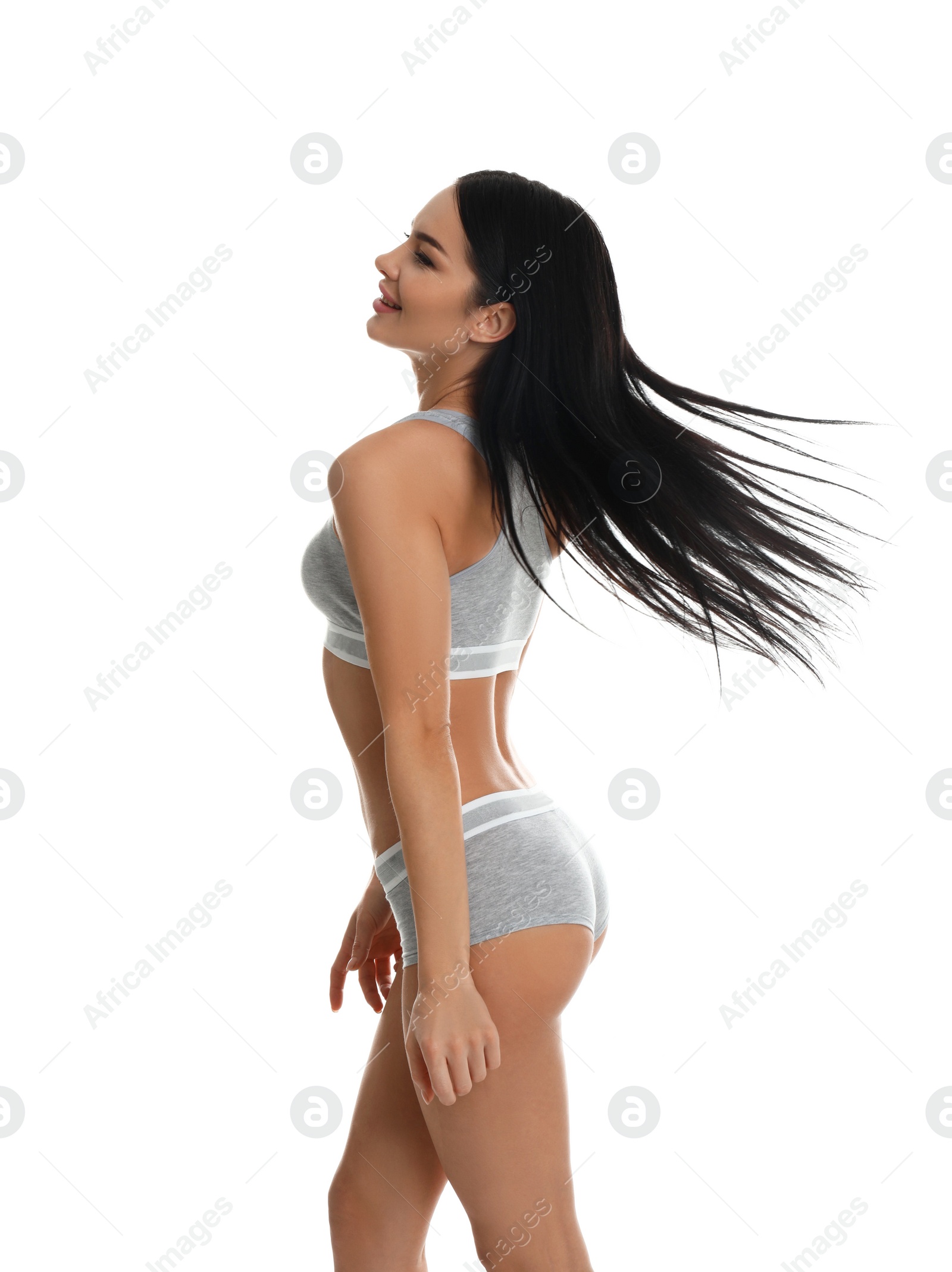 Photo of Beautiful young woman in grey sportive underwear isolated on white