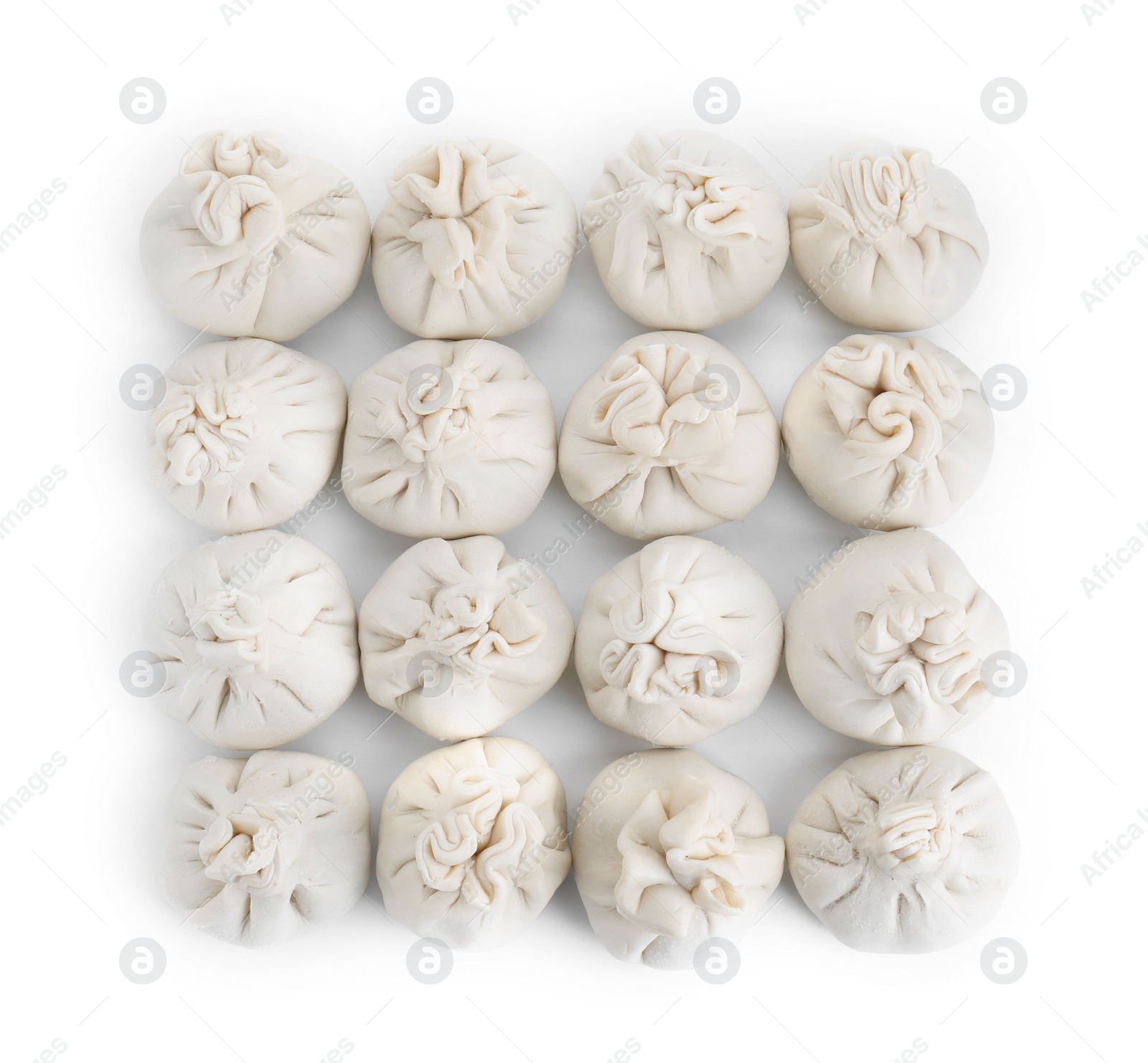 Photo of Many uncooked khinkali (dumplings) isolated on white, top view. Georgian cuisine