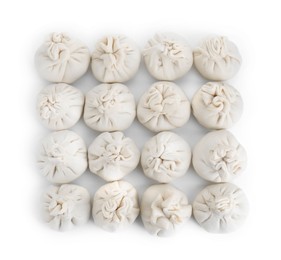 Many uncooked khinkali (dumplings) isolated on white, top view. Georgian cuisine