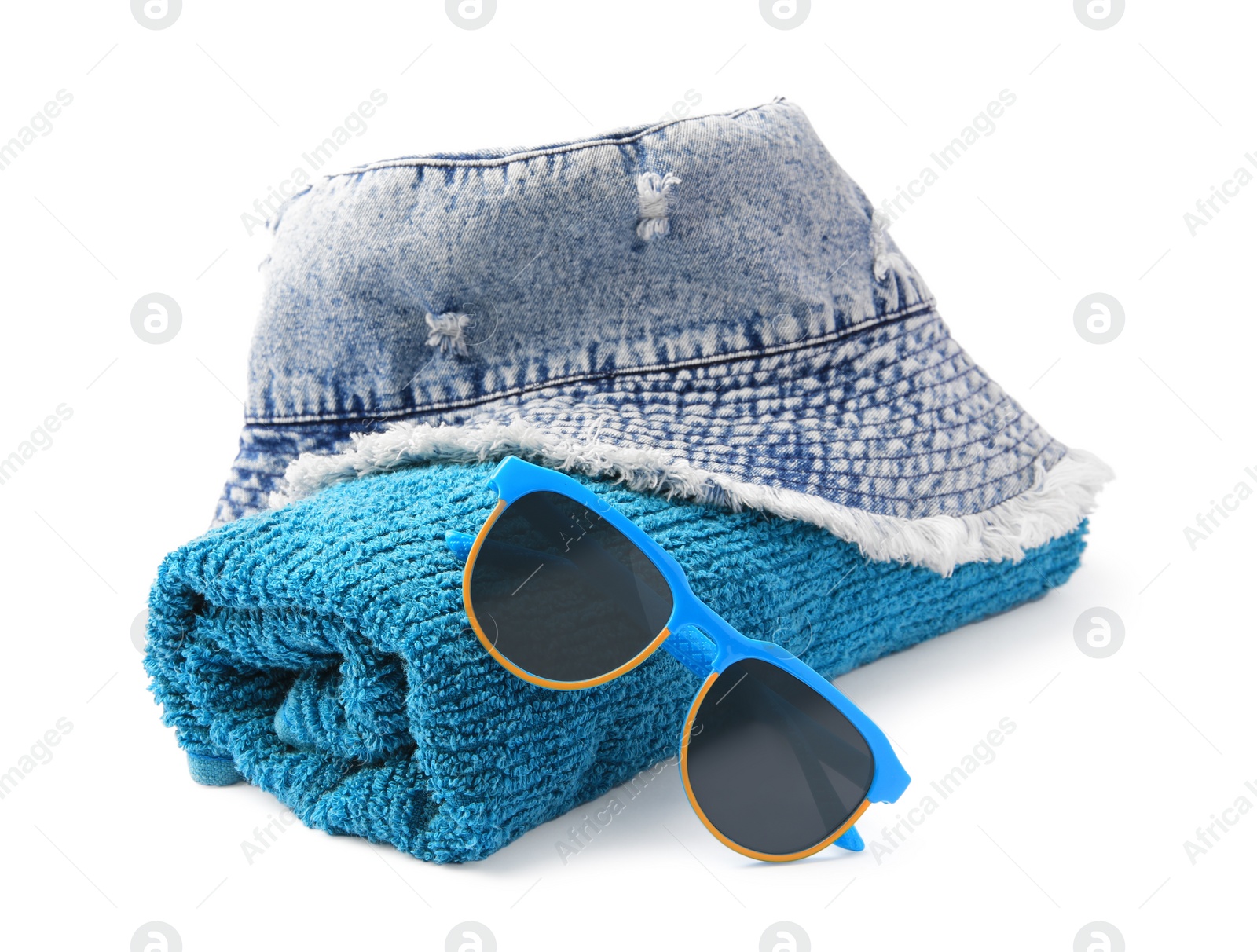 Photo of Denim hat, terry towel and sunglasses isolated on white. Beach objects