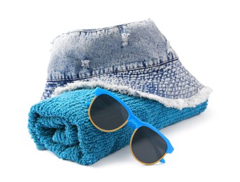Photo of Denim hat, terry towel and sunglasses isolated on white. Beach objects