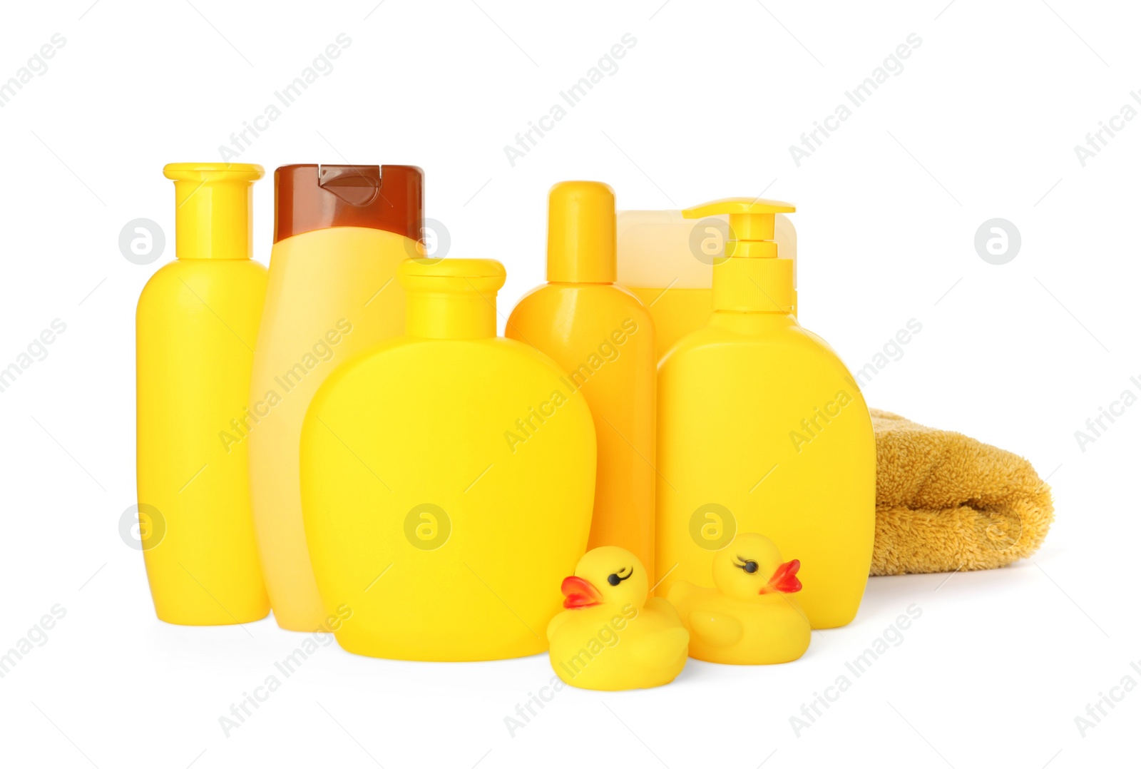 Photo of Set of baby cosmetic products, towel and rubber ducks on white background