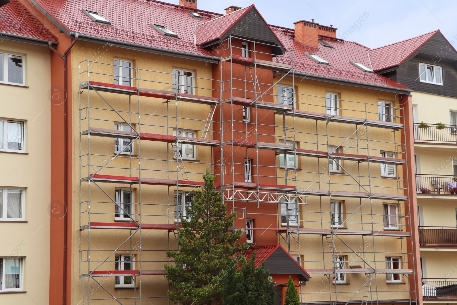 Photo of Beautiful view of modern building with scaffolding