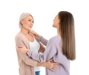 Photo of Portrait of young woman with her mature mother on white background