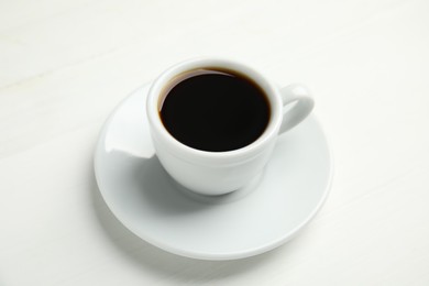 Photo of Cup of hot aromatic espresso on white background