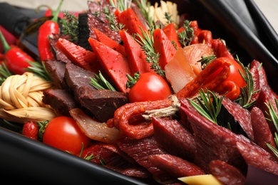 Photo of Beautiful edible bouquet with meat, cheese and vegetables, closeup