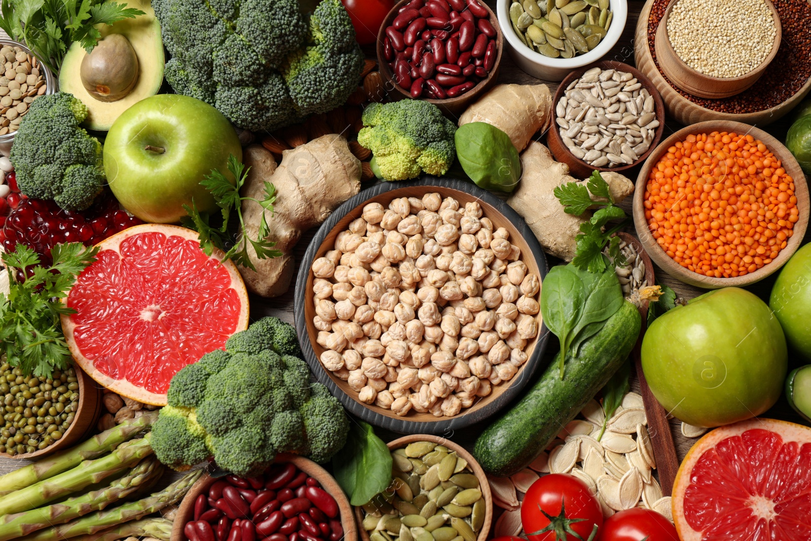 Photo of Fresh vegetables, fruits and seeds on table, flat lay