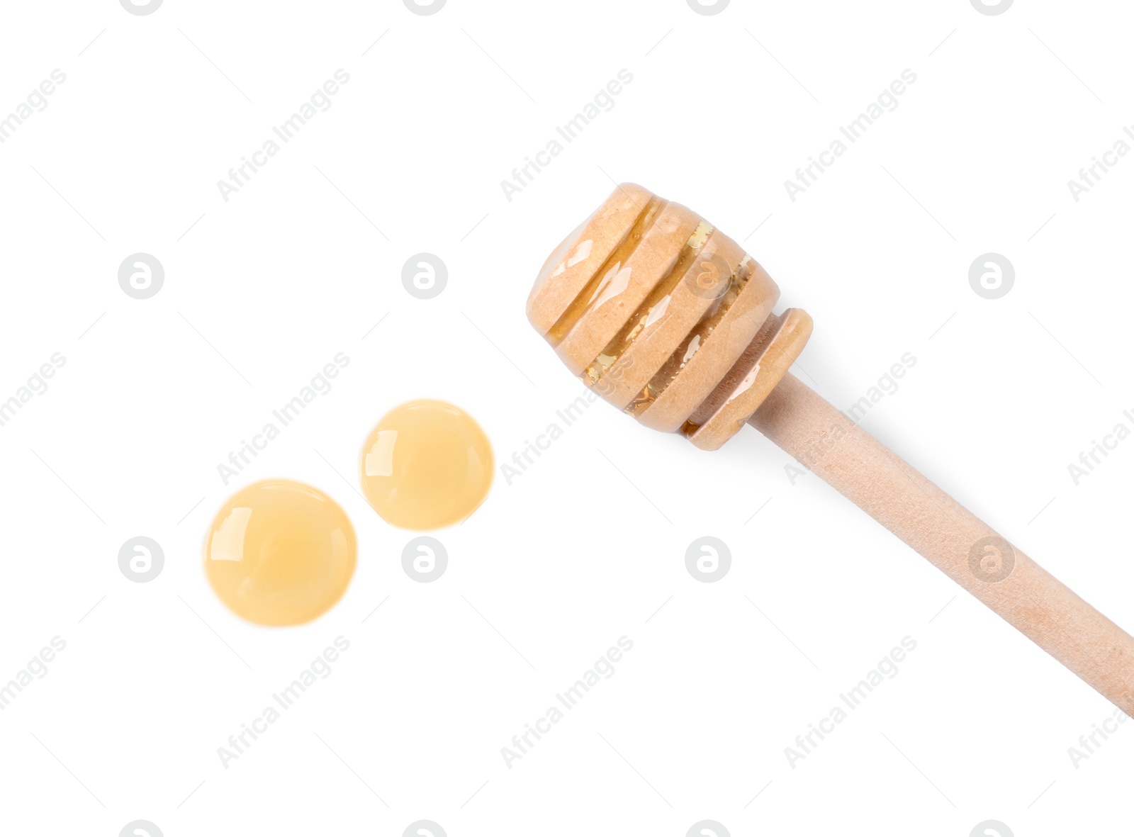 Photo of Wooden dipper and fresh honey on white background, top view