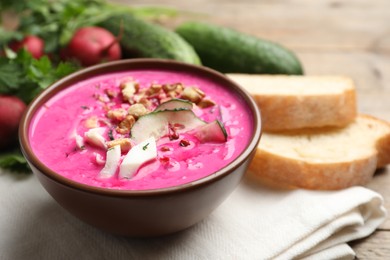 Delicious cold summer beet soup on table