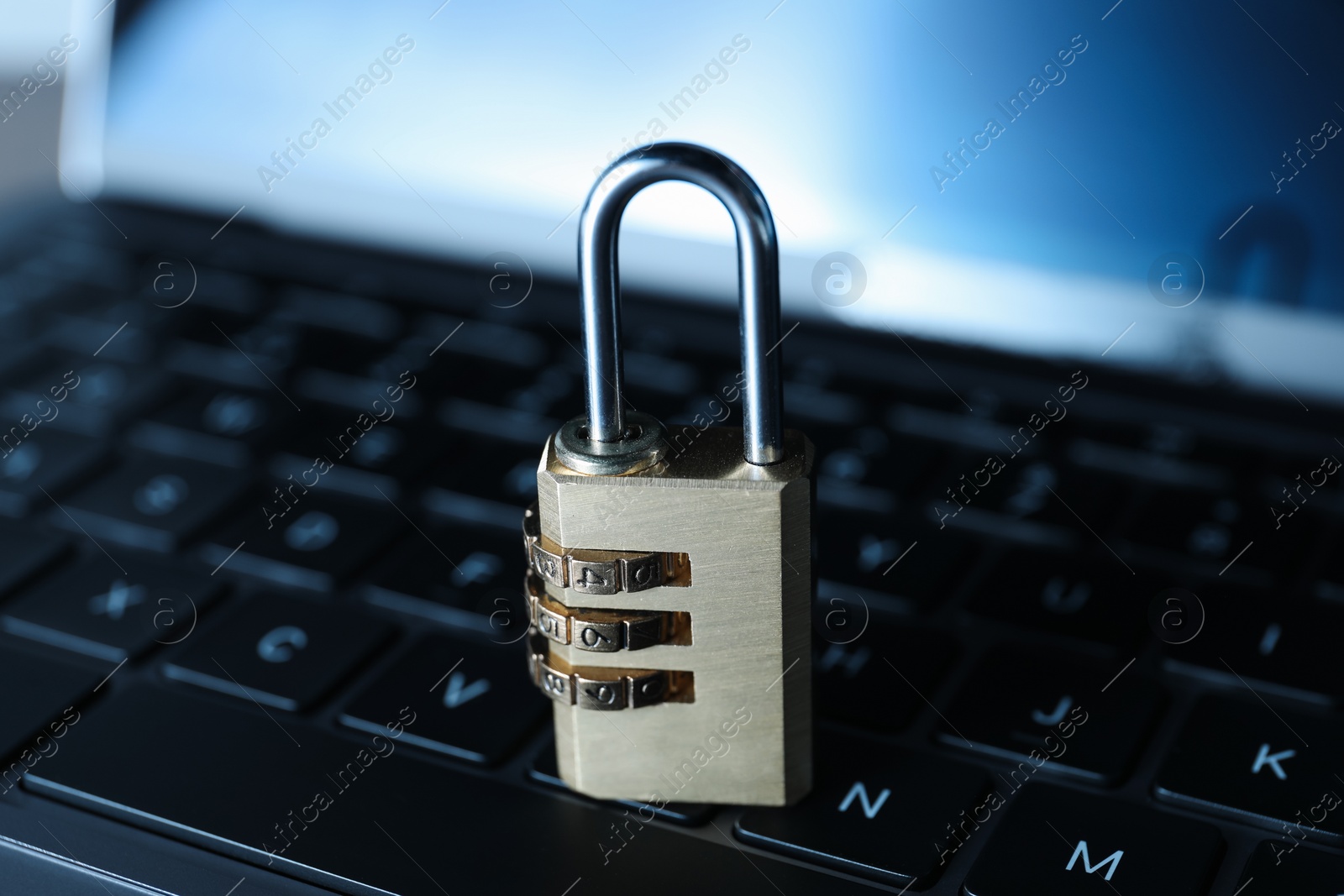 Photo of Cyber security. Padlock on laptop, closeup view