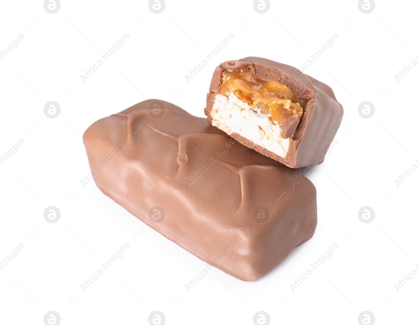 Photo of Pieces of tasty chocolate bars with nougat on white background