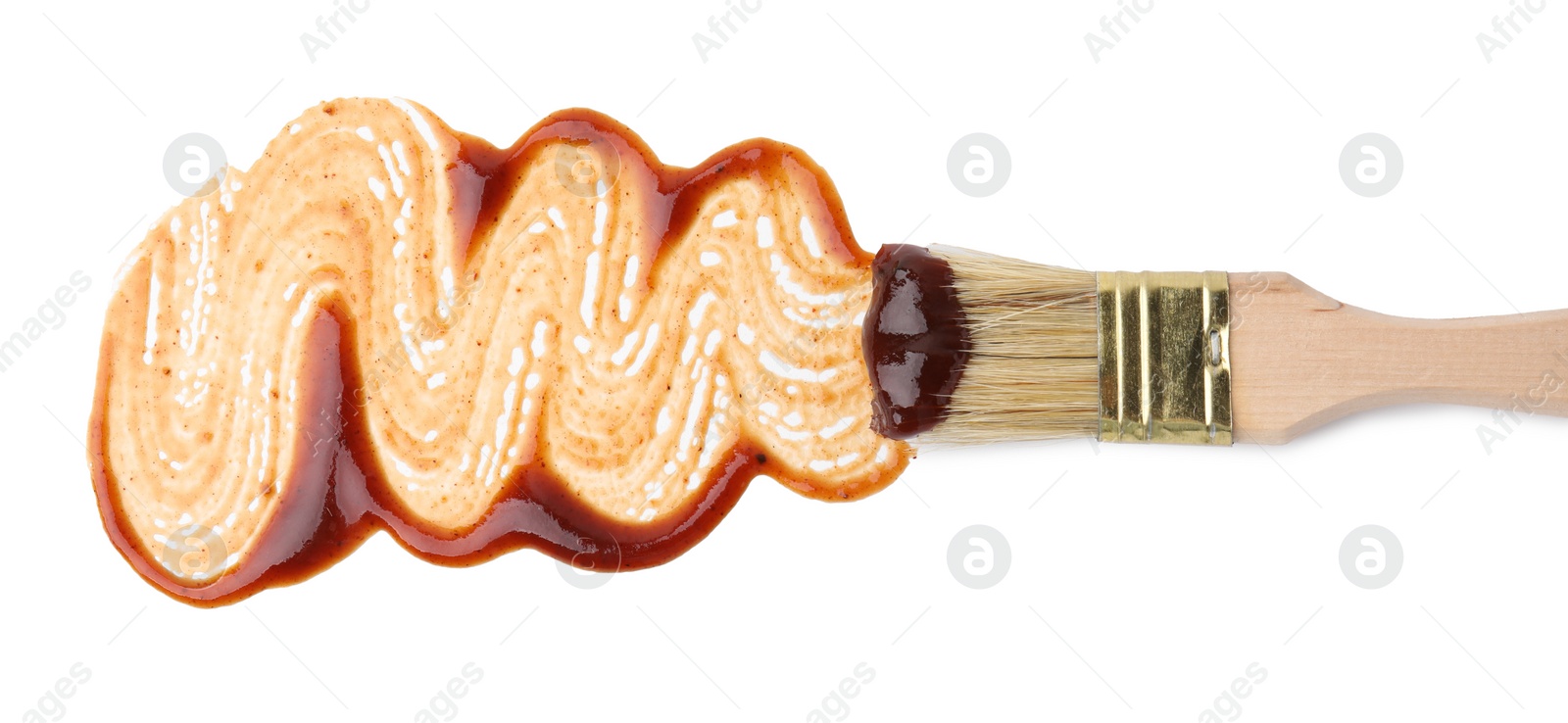 Photo of Basting brush with fresh marinade isolated on white, top view